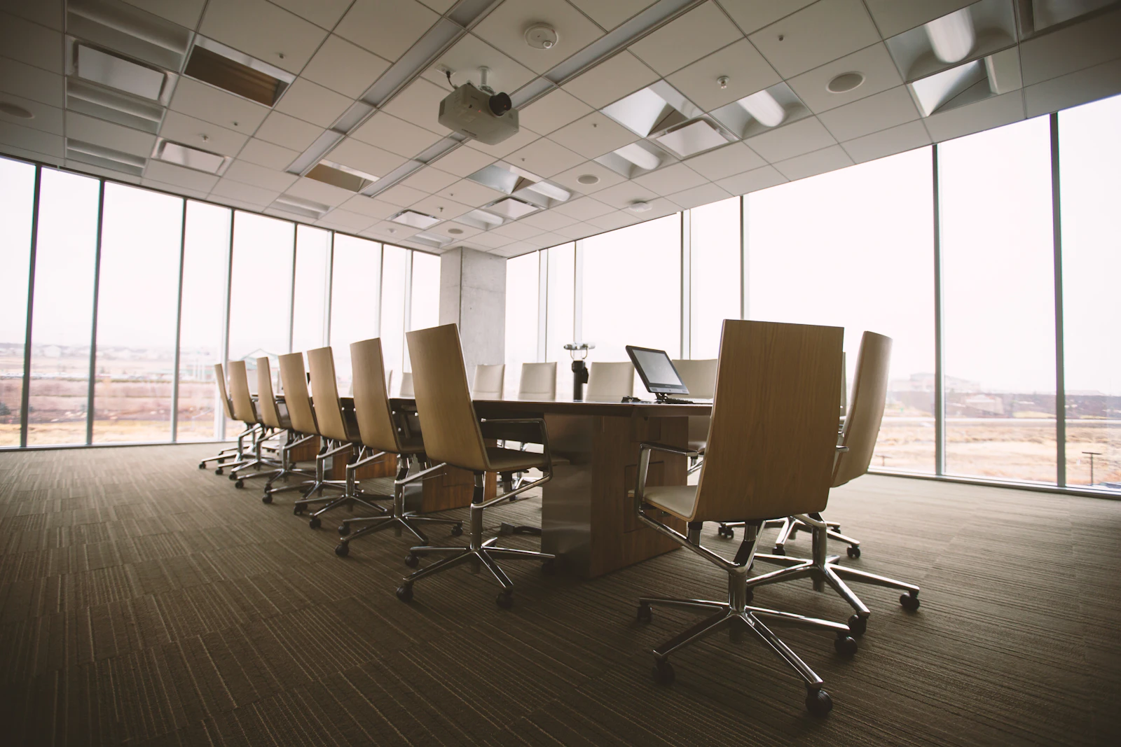Executive boardroom surrounded by floor-to-ceiling windows
